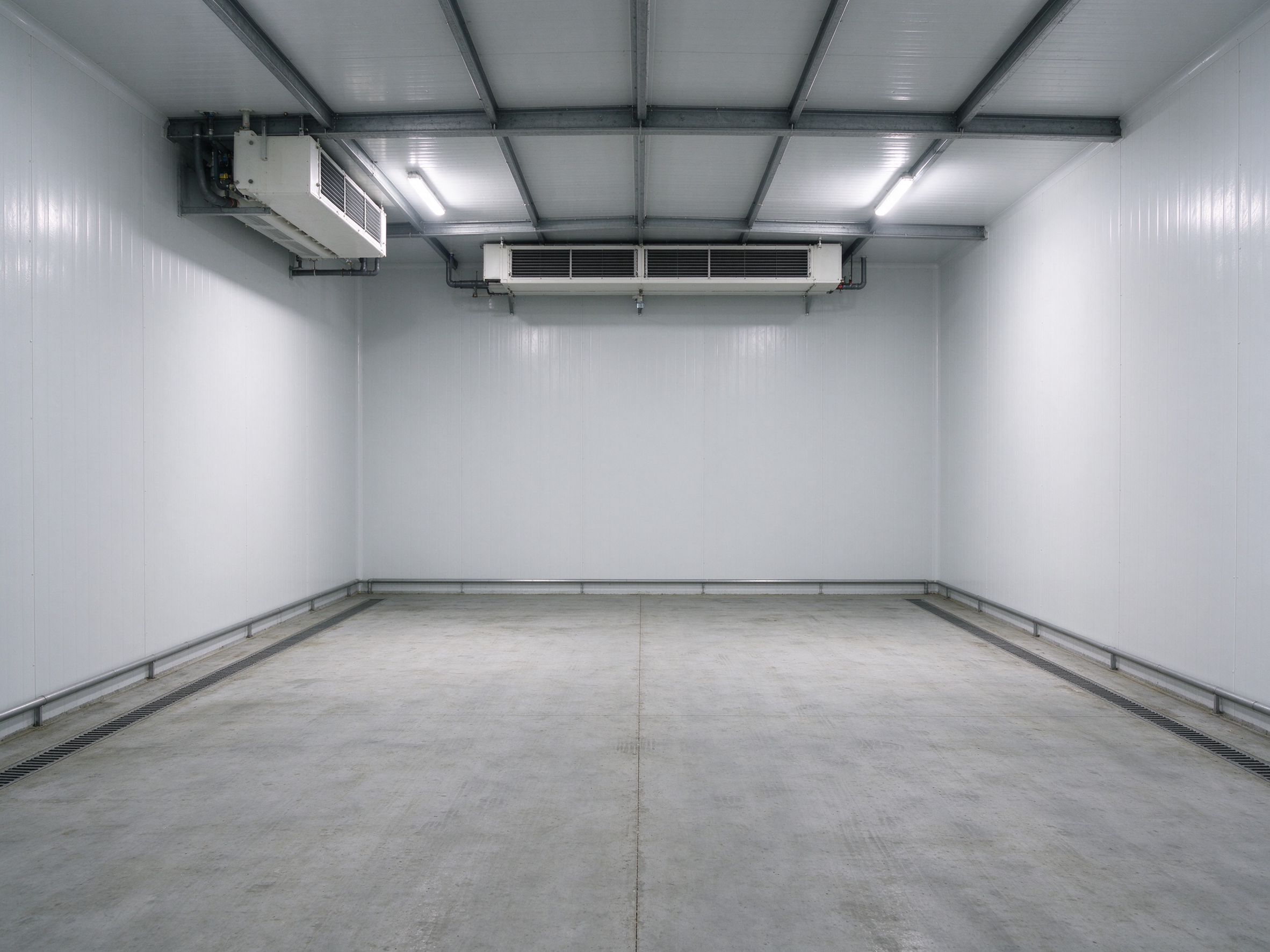 Inside a cold store: insulated panels and evaporator units (illustrative concept image)